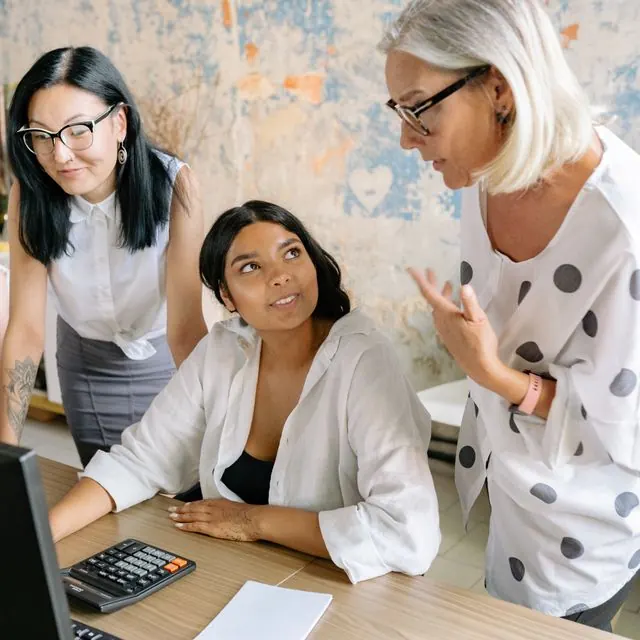 Three colleagues reviewing a payment run